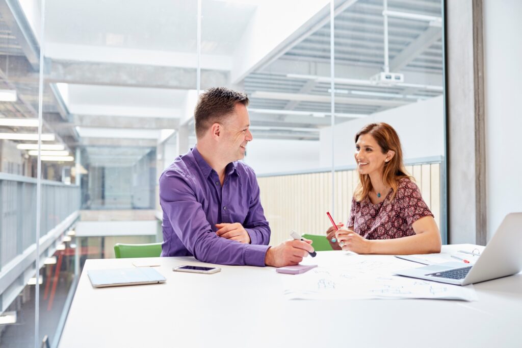 Male and female designers meeting in design studio